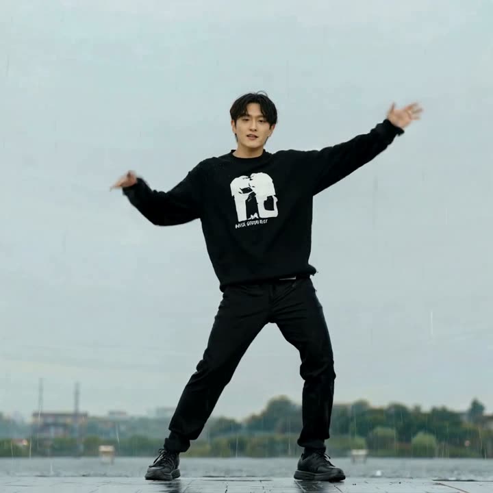 person dancing in the rain